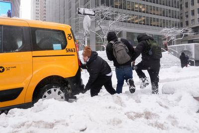 The Latest: Northeast snowstorm forces millions to stay home, disrupts flights and closes schools
