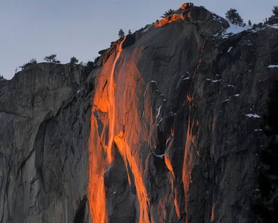 Visitors flock to Yosemite for firefall light show despite heavy snow