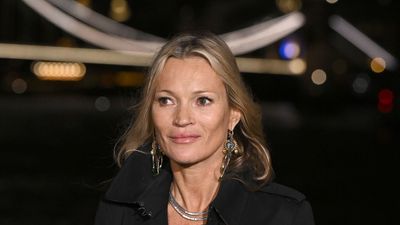 Kate Moss embraces an unbeatable styling duo at the Burberry show – a satin LBD with a black trench coat