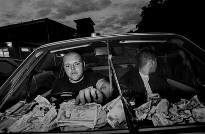 Two skinheads counting the takings from a neo-Nazi gig: Leo Regan’s best photograph