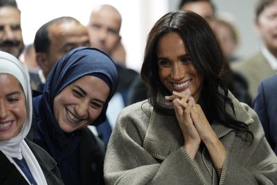 Meghan mixes affordable and luxury in Zara style staples on her trip to Jordan with Harry