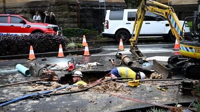 Sinkhole opens after rain deluge forces evacuations