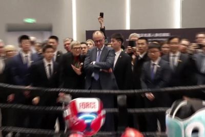 German chancellor ends trip to China by attending robot boxing match