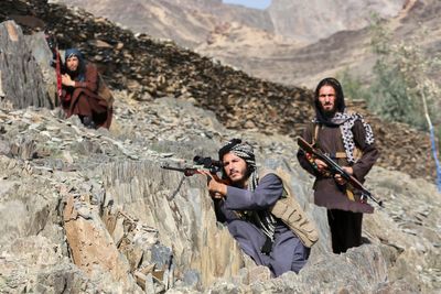 Afghanistan's soldiers guard the border with Pakistan as both countries trade attacks, in photos