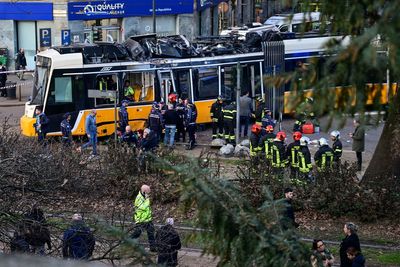 Two dead and dozens injured after tram derails in central Milan