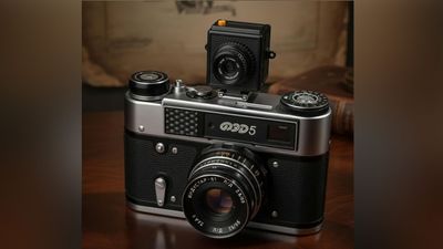 This odd compact digital camera snaps a photo every time you take a shot on film. But will it be a hit or a miss?