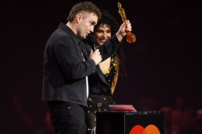 Olivia Dean and Sam Fender win song of the year as Brit Awards begin