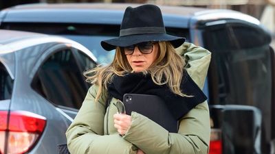 I never would have thought to pair a fedora hat with a puffer coat, but nobody makes layering up look as chic as Jennifer Aniston