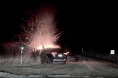 Unconscious driver stuck in burning car pulled to safety by police