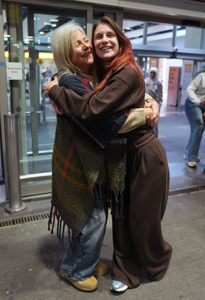 Families reunite in emotional scenes as flight from Abu Dhabi carrying stranded Brits lands at Heathrow