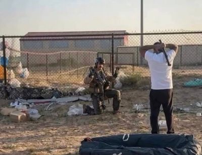 Moment local man threatens downed F-15 pilot with metal pole in Kuwait: 'Back up, I'm American'
