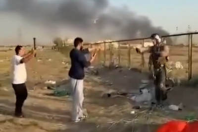 Moment Kuwaiti man threatened downed US pilot with metal pipe after mistaking him for Iranian soldier