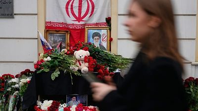 People lay flowers at makeshift Khamenei memorial in Moscow