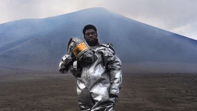 Vanuatu's 'barefoot volcanologist' stands at ash- and sulfur-spewing Mount Yasur in award-winning photograph