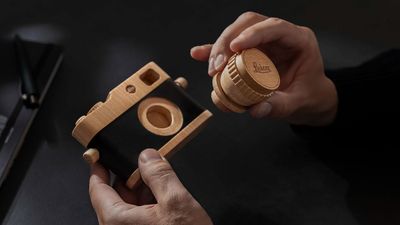 This wooden Leica M toy camera brings back the charm of photography with the signature red dot and lettering
