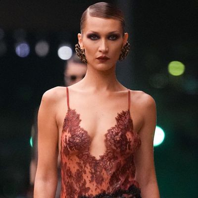 Bella Hadid Walks Her Fourth Saint Laurent Fashion Show Straight in Lingerie-Inspired Lace
