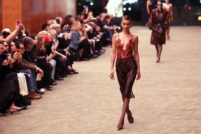 Bella Hadid walks Saint Laurent’s tuxedo revival at Paris Fashion Week