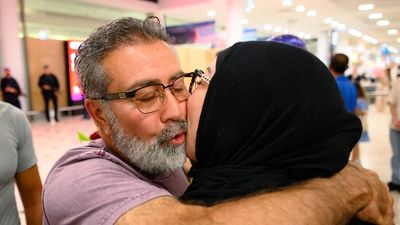 War-trapped Aussies arrive home on first Dubai flight