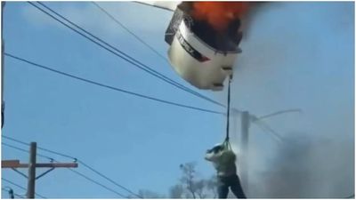 Watch: Louisiana worker dangling from fiery cherry picker before plunging to ground