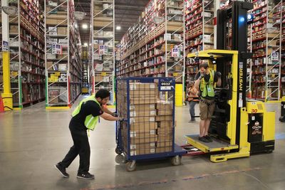 Amazon warehouse employee fired while recovering from surgery to fix hernias he got on job, lawsuit says