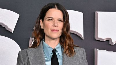 Neve Campbell leans into one of this season's most surprising accessory trends to finish off her tailored look