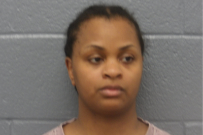 Cleveland woman arrested on murder charges after bodies of two half-sisters found in suitcases, police say