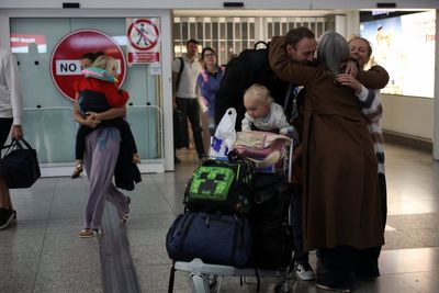 First repatriation flight from Middle East lands in UK as passengers report chaotic scenes