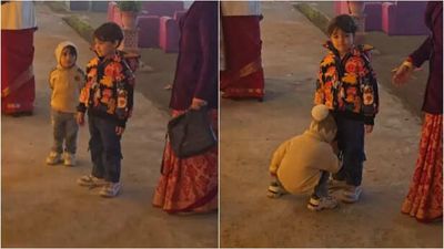 Toddler wins hearts with his innocent 'height check' before touching elders' feet