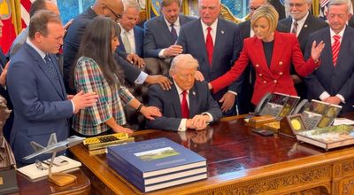 Moment pastors put their hands on Donald Trump in White House as they pray over Iran war