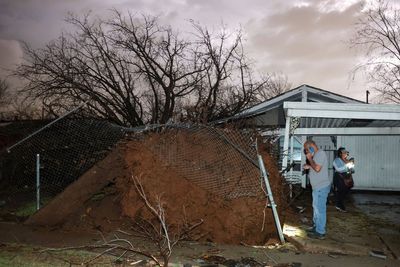 Deadly tornadoes flatten homes as communities clean up severe storm damage