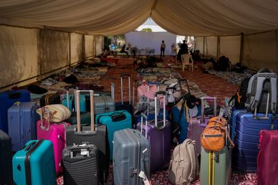 Photos show travellers stuck in the UAE taking shelter from war at Indian expat's home