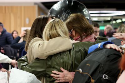 Relieved family reunions at Dublin Airport as chartered flight lands