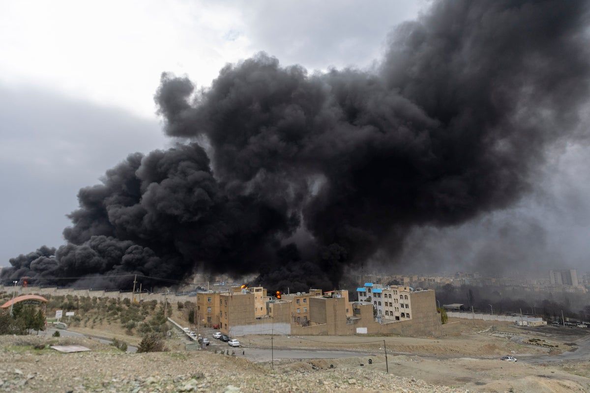 Tehran blanketed in smoke after Israel hits fuel…
