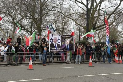 Demonstrators gather outside Iranian embassy in support of war