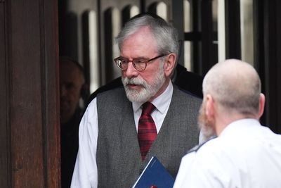 Gerry Adams arrives at High Court for bombings trial