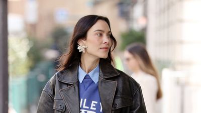Alexa Chung embraces this season's biggest jacket trend – pairing a Mango leather bomber with straight-leg jeans and ballet flats