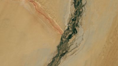 Gemstone-filled river and striped mountain ridge form massive 'Y' in China's revitalized desert — Earth from space