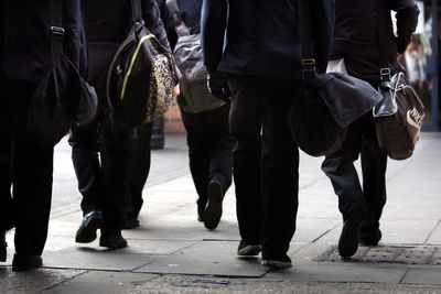 Teacher banned from the classroom for sending former pupil money and spending £1,000 on fast food for students