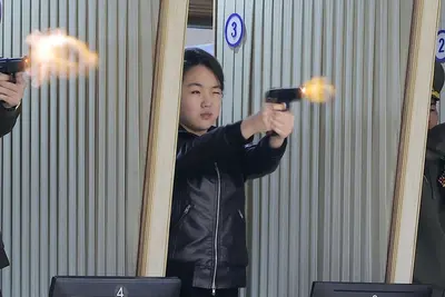 Kim Jong Un and teenage daughter try out new pistols in further hint at North Korea succession