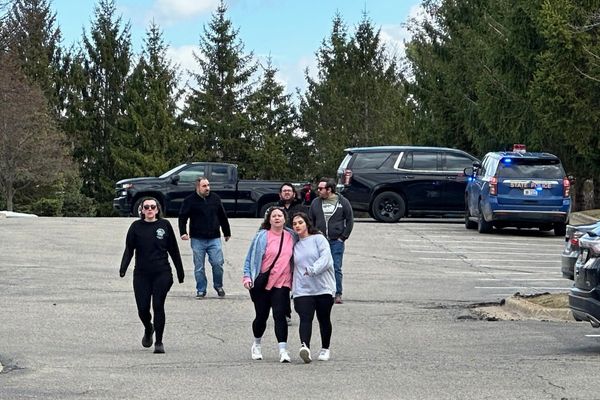 The Latest: Man fatally shot attacking Michigan synagogue, AP source says