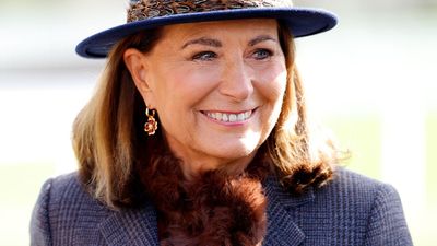 Carole Middleton just made a stylish debut at Cheltenham in navy and chocolate brown - and her hat looks rather familiar