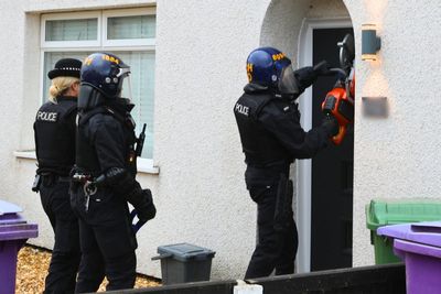 Gold bar and gold suitcase seized in week-long county lines crackdown - as police make 2,000 arrests