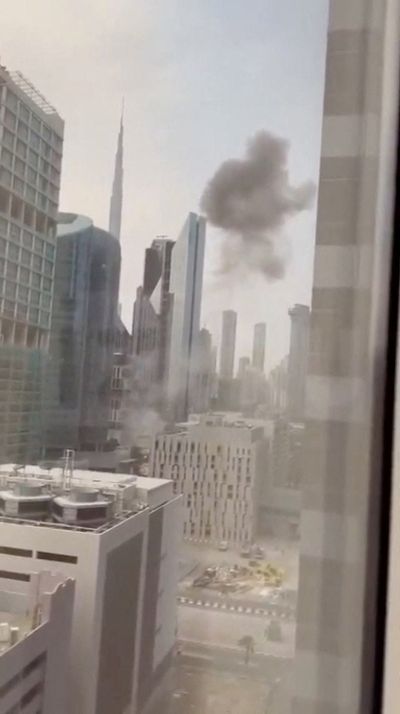 Dubai under attack: Building in UAE city's financial centre hit by 'kamakaze drone' debris as war rages