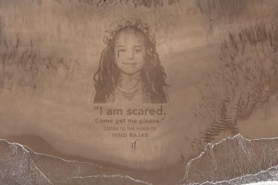 Giant sand portrait of girl in Voice Of Hind Rajab created on Yorkshire beach