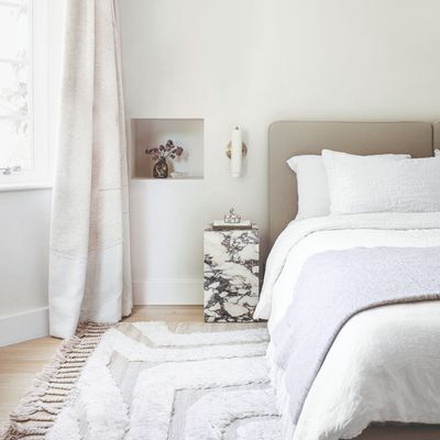 The secret 'rug rules' interior designers use to create the most elegant bedrooms – how to get sizing and placement right
