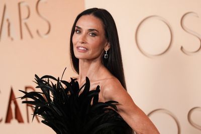 Demi Moore’s striking feathered Gucci gown causes a stir at the Oscars