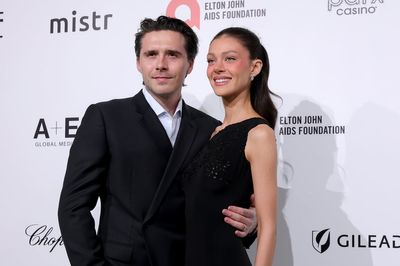 Brooklyn Beckham cosies up to wife Nicola Peltz at Elton John’s Oscars party after Mother’s Day snub