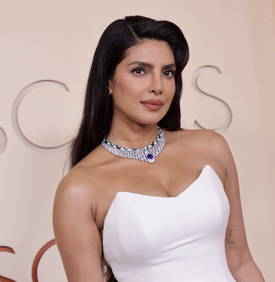 Priyanka Chopra-Jonas Continues a 10-Year-Old Oscars Red Carpet Tradition in a Feathered Dior Dress