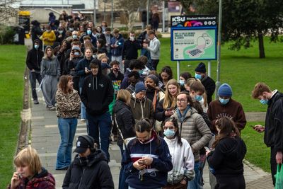 University students queue for antibiotics amid meningitis outbreak