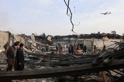 Rescue crews dig bodies out of the ruins of a Kabul hospital hit in an airstrike blamed on Pakistan